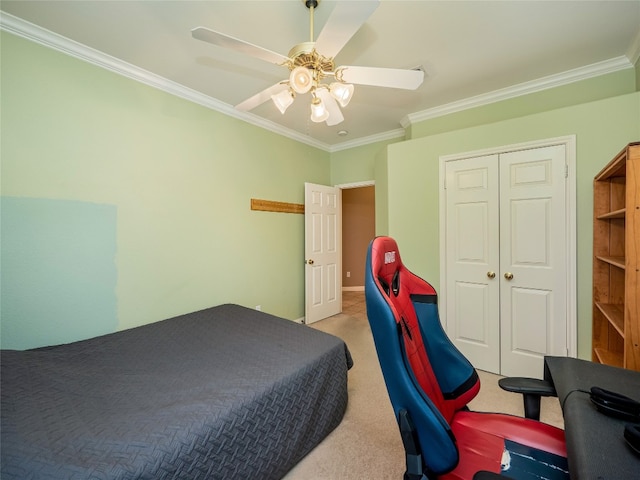 bedroom with ceiling fan, light carpet, a closet, and ornamental molding