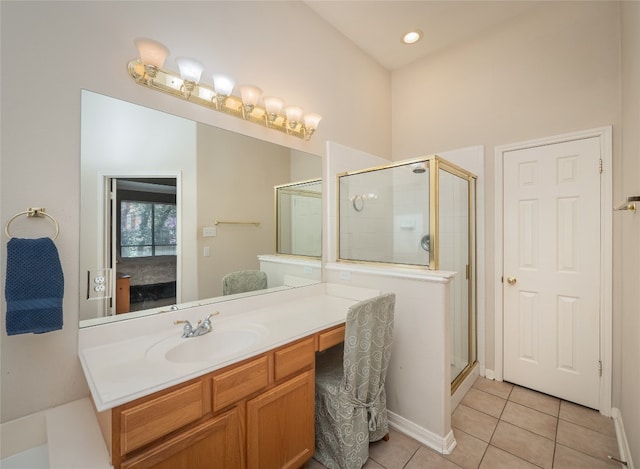 bathroom with tile patterned floors, connected bathroom, vanity, and a shower stall