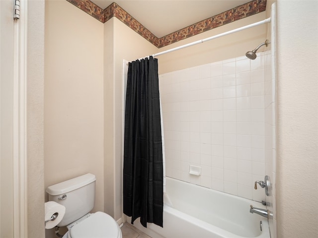 full bath featuring tile patterned flooring, toilet, and shower / tub combo