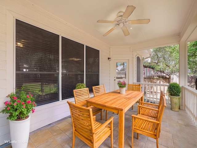 view of patio featuring outdoor dining space and ceiling fan