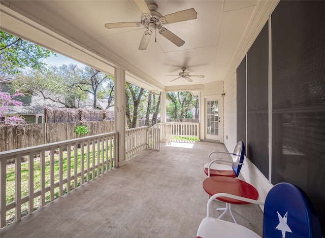 view of patio / terrace featuring ceiling fan and fence