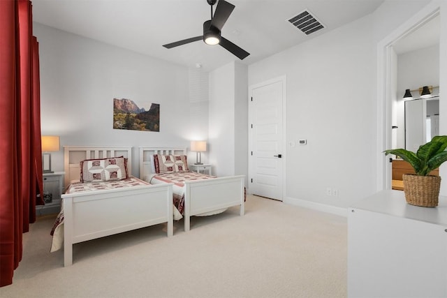 bedroom featuring visible vents, carpet flooring, a ceiling fan, and baseboards