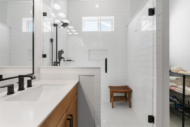 bathroom featuring a stall shower and vanity