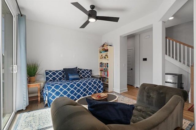 bedroom with wood finished floors, ceiling fan, and recessed lighting