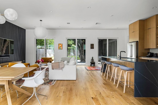 interior space featuring recessed lighting, visible vents, and light wood-style flooring