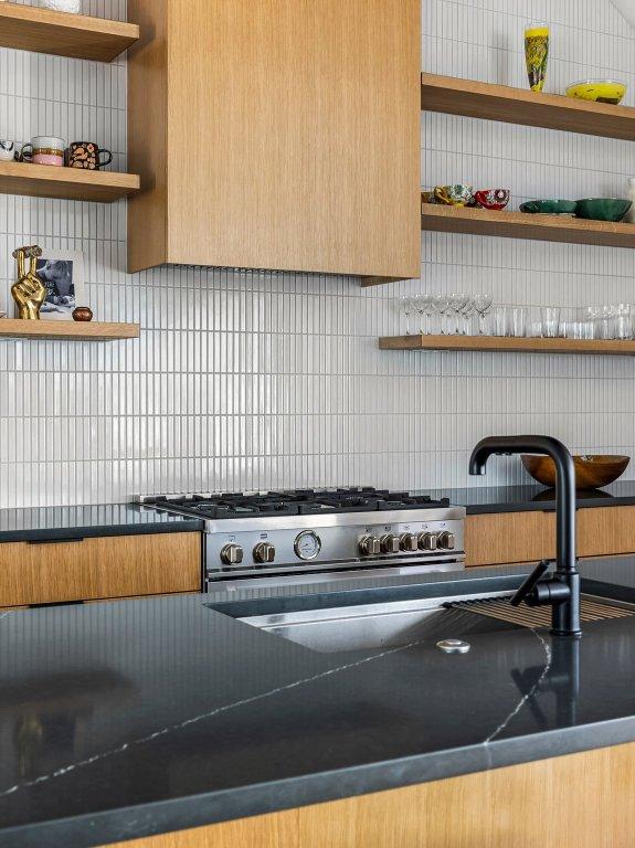 kitchen featuring open shelves, dark countertops, and tasteful backsplash