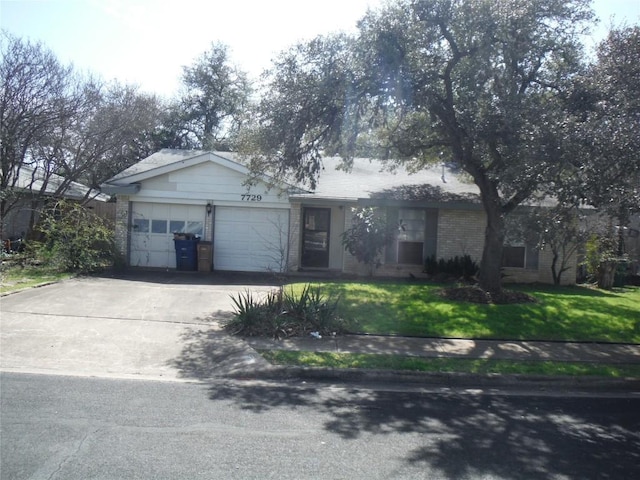 ranch-style home featuring brick siding, concrete driveway, a front yard, and a garage