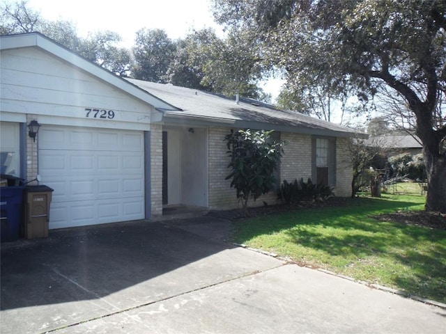 ranch-style home with concrete driveway, an attached garage, brick siding, and a front lawn