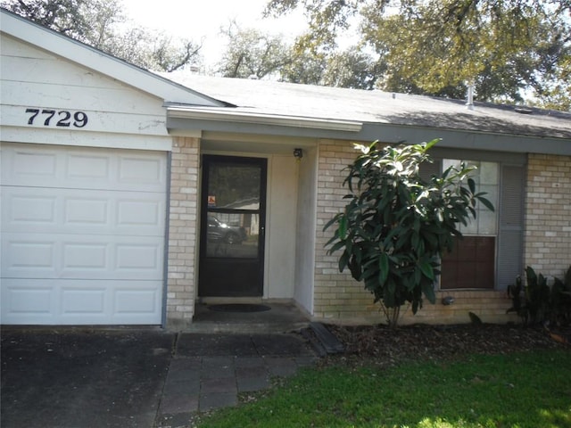 entrance to property with brick siding