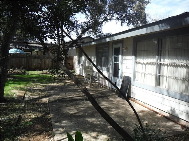 view of patio featuring fence