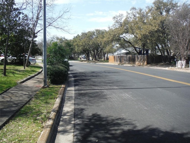 view of street featuring curbs