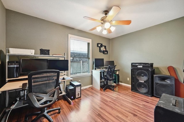 home office featuring wood finished floors, baseboards, and ceiling fan