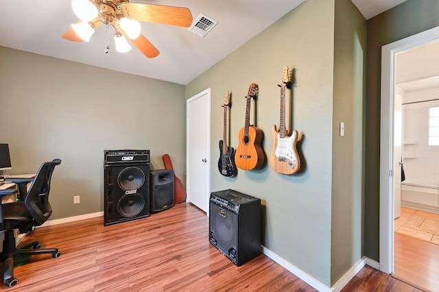 office space with visible vents, baseboards, and wood finished floors