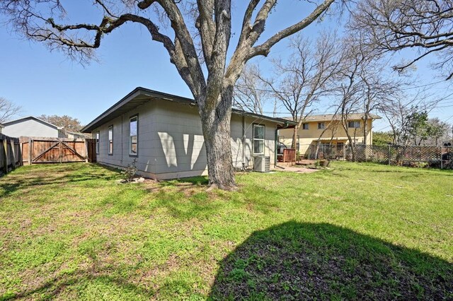 5303 Kings Hwy, Austin, TX 78745 - back of house with a gate and central air condition unit