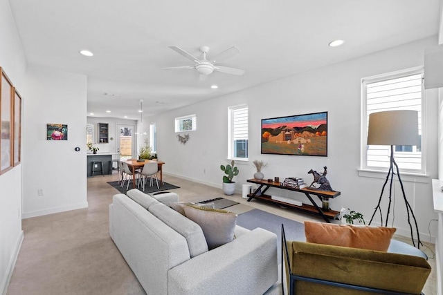 living room featuring plenty of natural light, recessed lighting, and ceiling fan