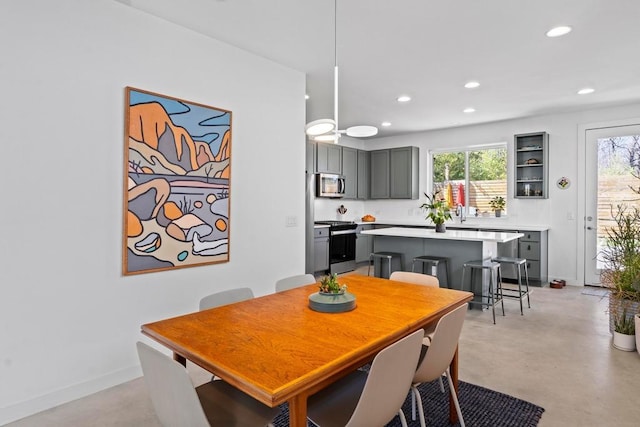 dining area with plenty of natural light, recessed lighting, and finished concrete floors