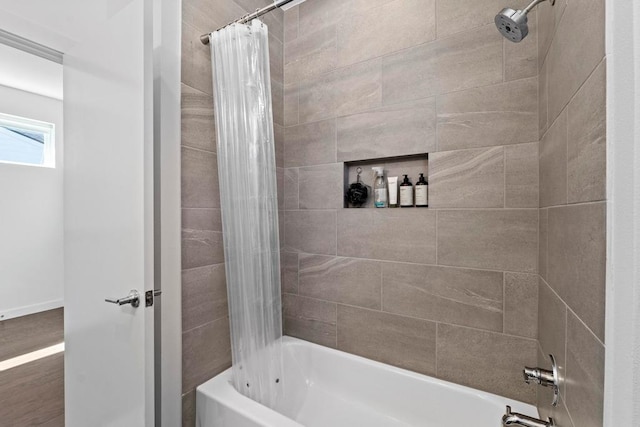 bathroom featuring shower / tub combo with curtain and wood finished floors