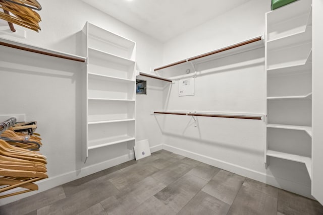 spacious closet with wood finished floors