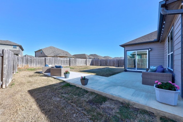 view of yard with a patio area, a fenced backyard, and an outdoor hangout area