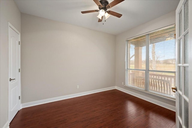 157 Mcgarity, Kyle, TX 78640 - spare room with dark wood-style flooring, a ceiling fan, and baseboards