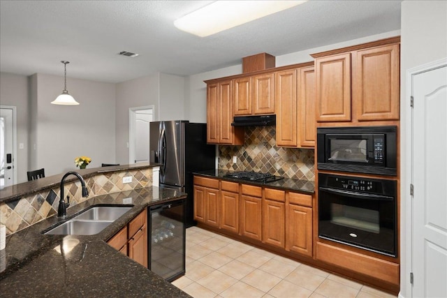 157 Mcgarity, Kyle, TX 78640 - kitchen featuring black appliances, a sink, under cabinet range hood, and backsplash