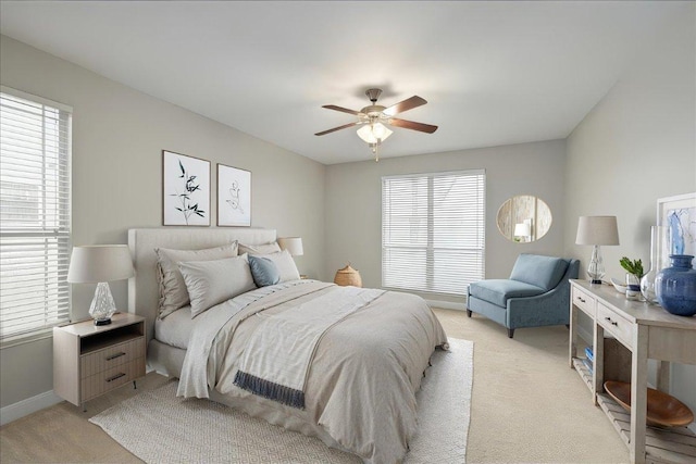 157 Mcgarity, Kyle, TX 78640 - bedroom with light carpet, baseboards, and ceiling fan