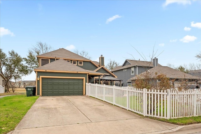 157 Mcgarity, Kyle, TX 78640 - view of front of home with concrete driveway, a garage, and a shingled roof