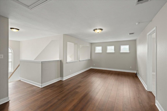 157 Mcgarity, Kyle, TX 78640 - spare room featuring dark wood finished floors and baseboards