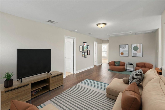 157 Mcgarity, Kyle, TX 78640 - living room featuring attic access, wood finished floors, and baseboards