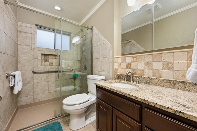 bathroom with vanity, ornamental molding, a shower stall, tile walls, and toilet