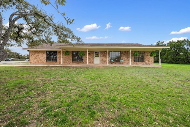 ranch-style home with a front lawn and brick siding