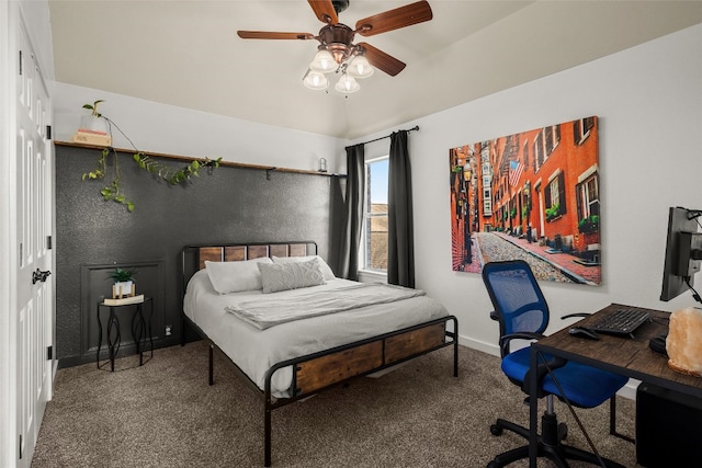 bedroom with baseboards, lofted ceiling, carpet, and a ceiling fan