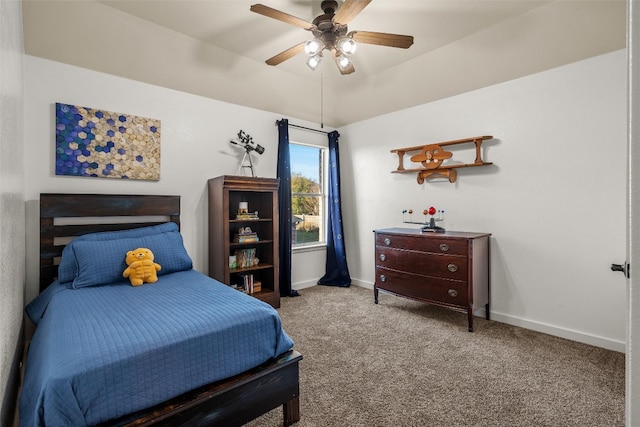 bedroom with baseboards, carpet floors, lofted ceiling, and a ceiling fan