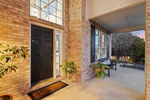 entrance to property with brick siding