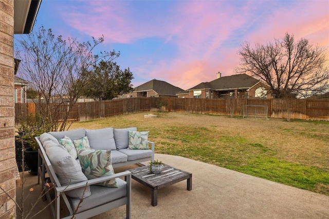 view of patio / terrace with an outdoor living space and a fenced backyard