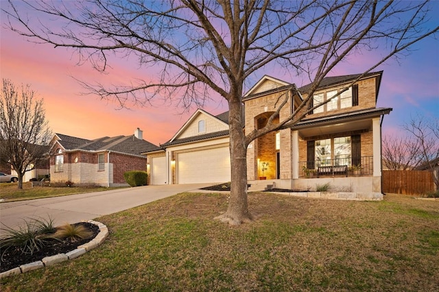 traditional home featuring brick siding, fence, a porch, a garage, and driveway