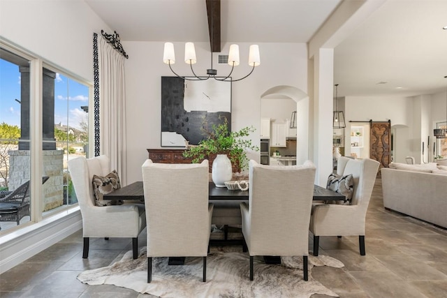 dining room with a chandelier, beam ceiling, arched walkways, and baseboards