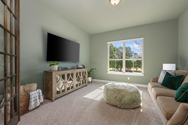 living area with carpet flooring and baseboards