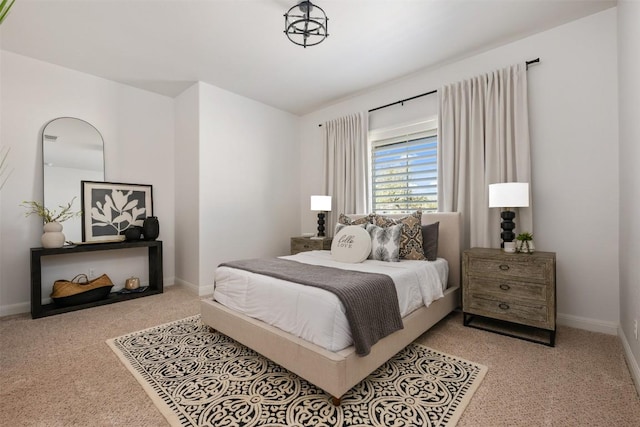 carpeted bedroom with baseboards