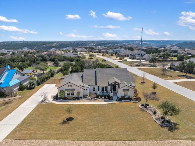 birds eye view of property with a residential view