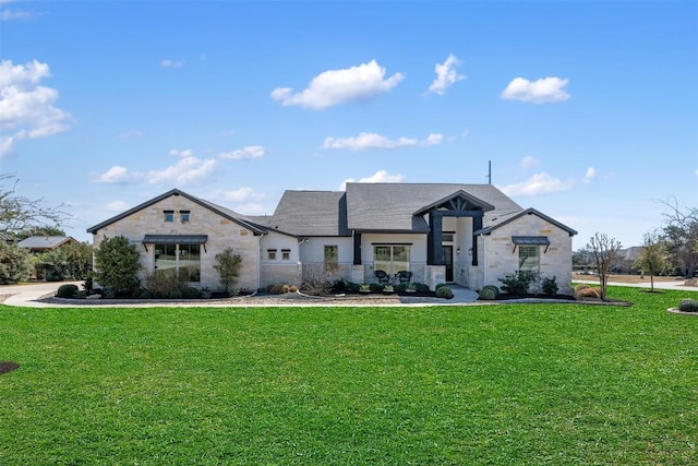 view of front of home featuring stone siding and a front lawn