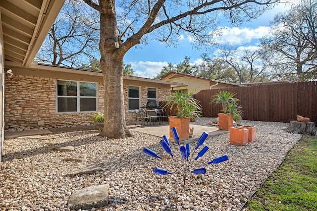 view of yard featuring a patio area and fence