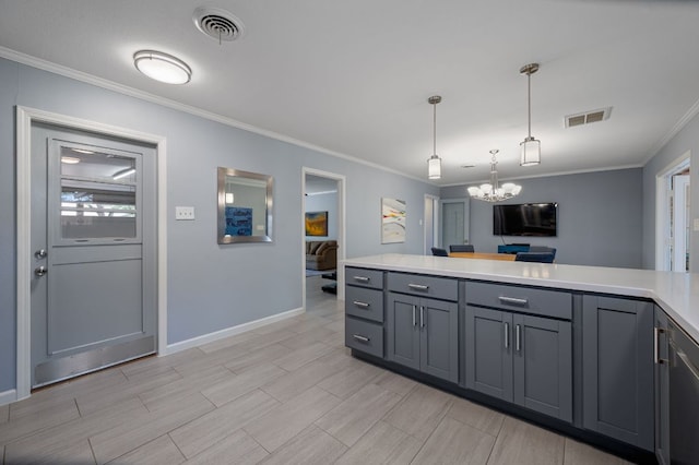 2709 Cascade Dr, Austin, TX 78757 - kitchen featuring a chandelier, light countertops, crown molding, gray cabinetry, and pendant lighting