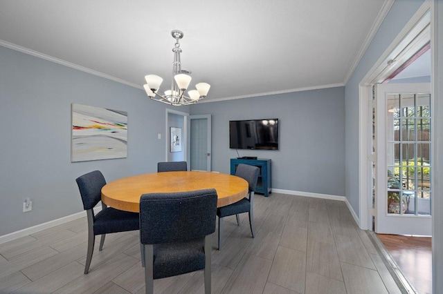 dining room with baseboards, an inviting chandelier, crown molding, and a healthy amount of sunlight