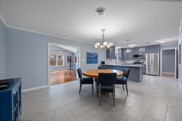 dining area featuring visible vents, ornamental molding, ceiling fan with notable chandelier, light wood-style floors, and baseboards