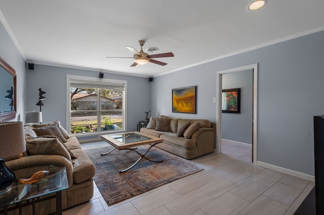 living room featuring baseboards, crown molding, and a ceiling fan