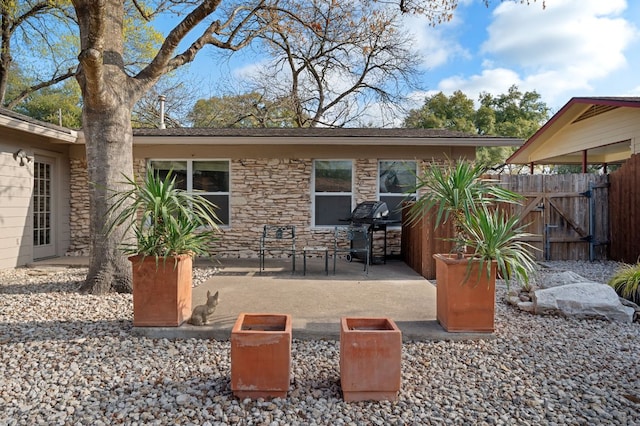 view of patio / terrace with a gate and fence