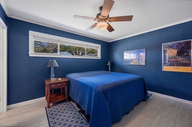 bedroom featuring a textured wall, baseboards, and ornamental molding