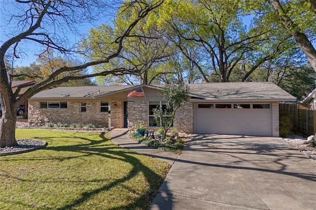 2709 Cascade Dr, Austin, TX 78757 - view of front of property featuring concrete driveway, an attached garage, and stone siding