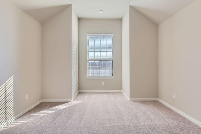 unfurnished room featuring carpet flooring and baseboards